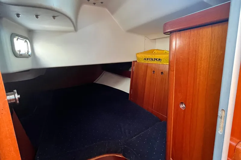 Slide: The Image of Cozy cabin interior of 1994 Beneteau First 35s7 sailboat with wooden cabinetry. - 40