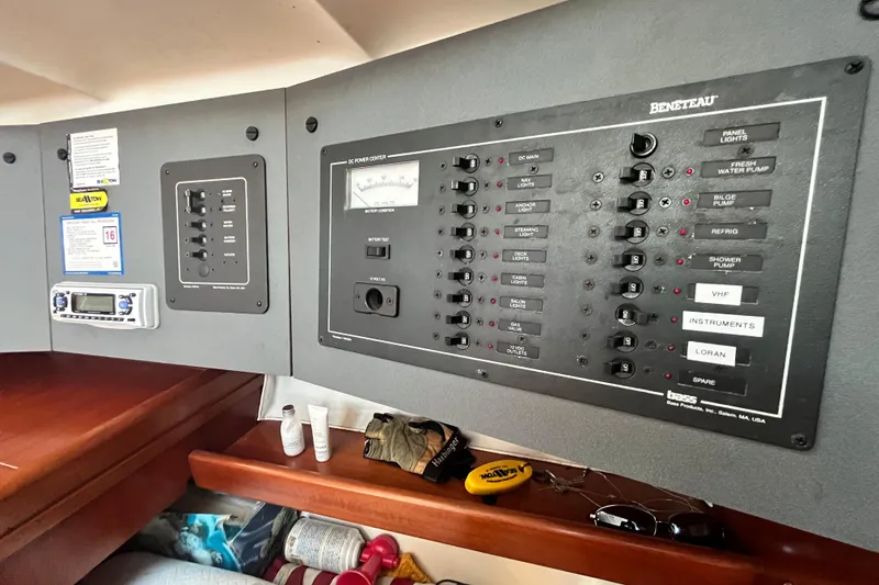 Slide: The Image of Electrical control panel on a 1994 Beneteau First 35s7 sailboat, featuring various switches and gauges. - 60