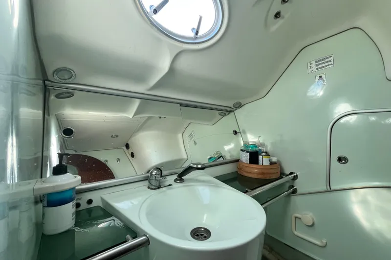 Slide: The Image of Bathroom interior of 1994 Beneteau First 35s7 yacht, featuring sink and toiletries. - 63