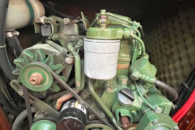 Slide: The Image of Engine of a 1994 Beneteau First 35s7 sailboat, showcasing mechanical components. - 68