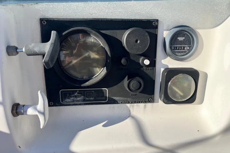 Slide: The Image of Control panel of a 1994 Beneteau First 35s7 sailboat with gauges and switches. - 8
