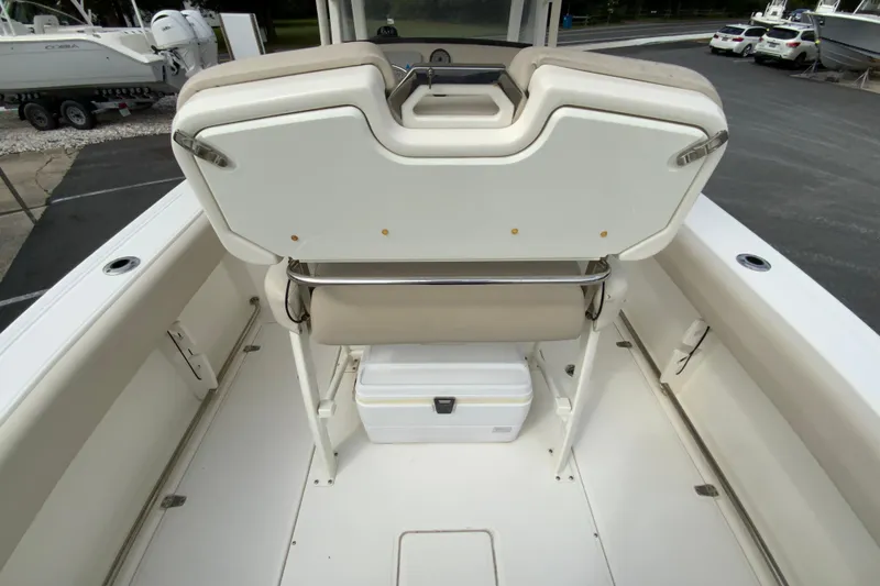 Slide: The Image of 2019 Boston Whaler 230 Outrage boat interior with seating and storage. - 19