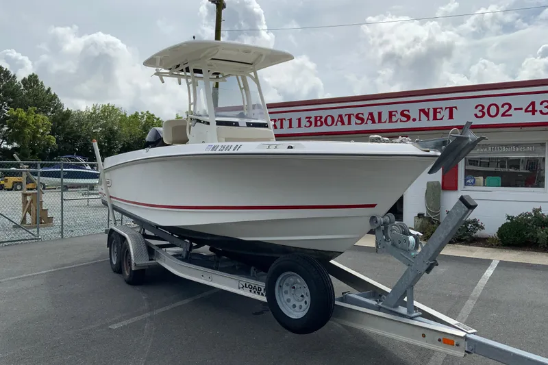 Slide: The Image of 2019 Boston Whaler 230 Outrage boat on trailer at dealership. - 2