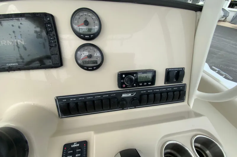 Slide: The Image of Dashboard of 2019 Boston Whaler 230 Outrage with Garmin display and controls. - 33