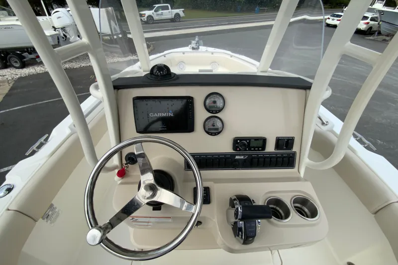Slide: The Image of 2019 Boston Whaler 230 Outrage helm with Garmin display and steering wheel. - 34