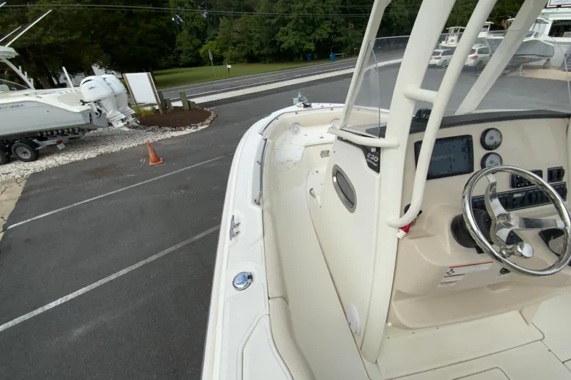 Slide: The Image of 2019 Boston Whaler 230 Outrage boat interior with steering wheel and dashboard. - 35