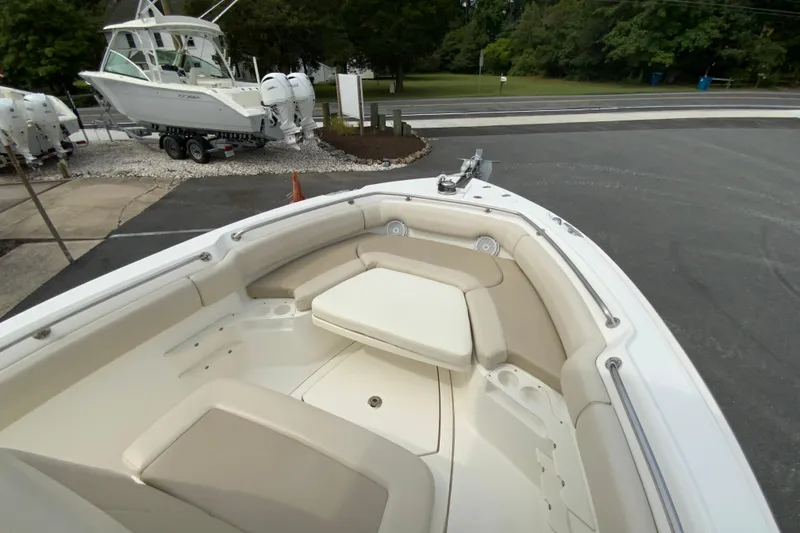 Slide: The Image of 2019 Boston Whaler 230 Outrage boat with spacious seating and sleek design. - 42