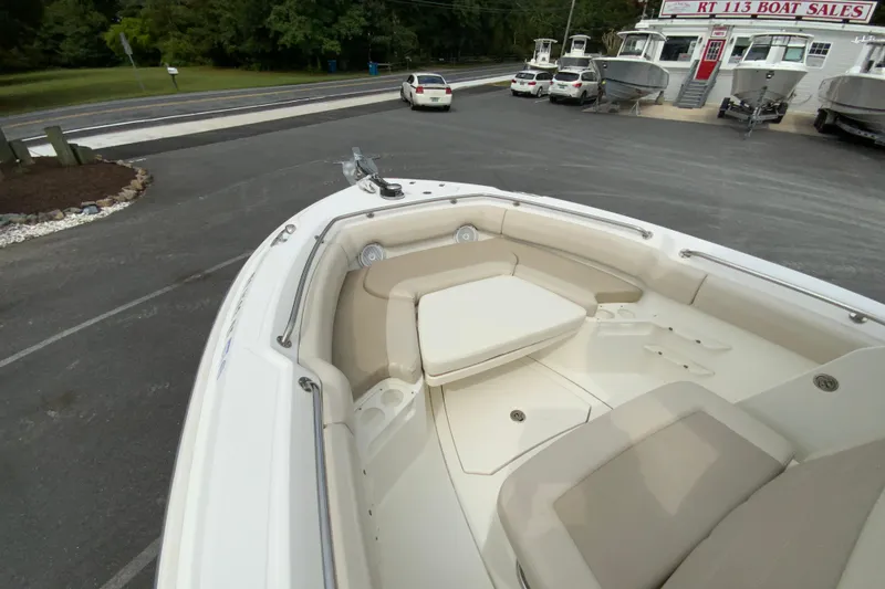 Slide: The Image of 2019 Boston Whaler 230 Outrage boat interior at dealership, featuring spacious seating. - 43