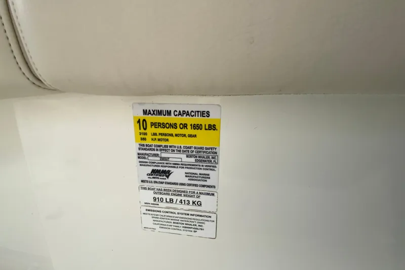 Slide: The Image of Capacity label on 2019 Boston Whaler 230 Outrage, max 10 persons or 1650 lbs. - 57