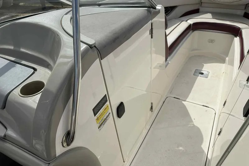 Slide: The Image of 1997 Maxum 2300 SR boat interior with seating and storage compartments. - 17