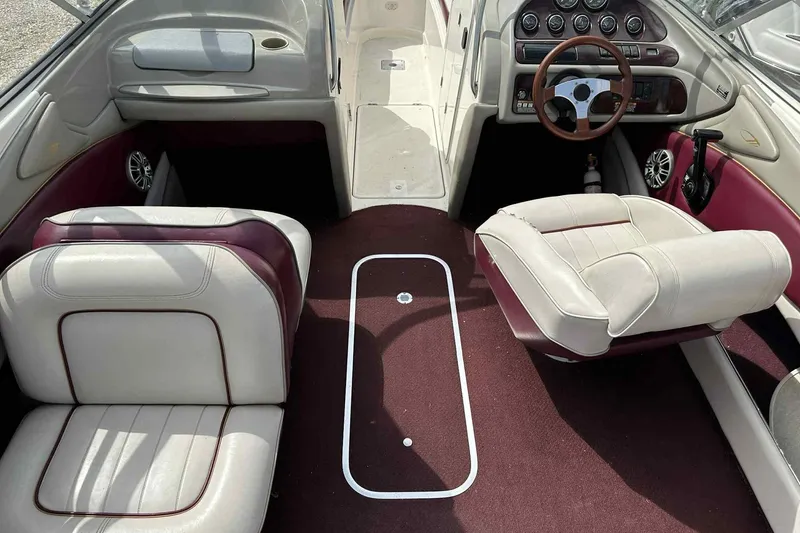 Slide: The Image of Interior of a 1997 Maxum 2300 SR boat with white and burgundy seating. - 20