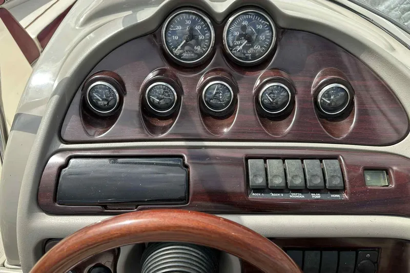 Slide: The Image of Dashboard of a 1997 Maxum 2300 SR boat with gauges and controls. - 22