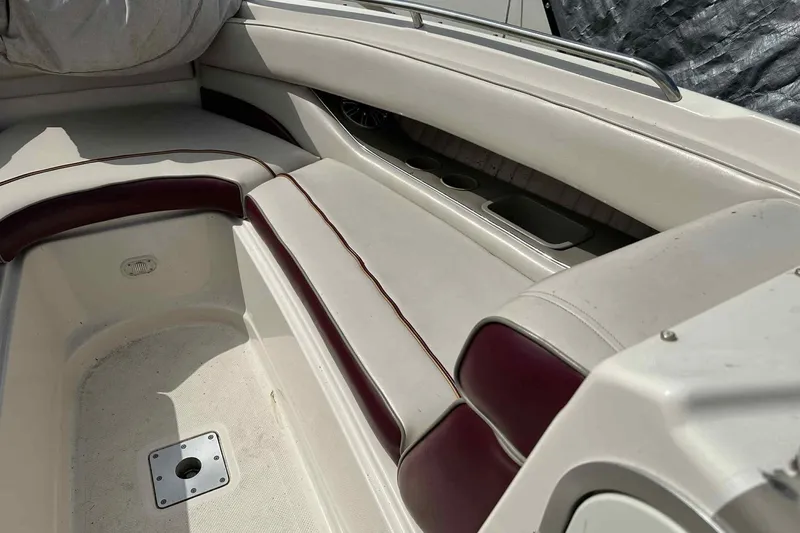 Slide: The Image of Interior seating of a 1997 Maxum 2300 SR boat with maroon accents. - 5