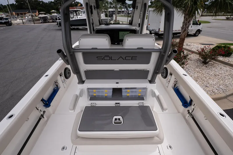 Slide: The Image of 2026 Solace 28 HCS boat interior with storage compartments and seating. - 11