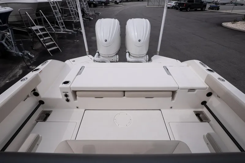 Slide: The Image of 2026 Solace 28 HCS boat deck with twin engines, spacious seating, and modern design. - 14