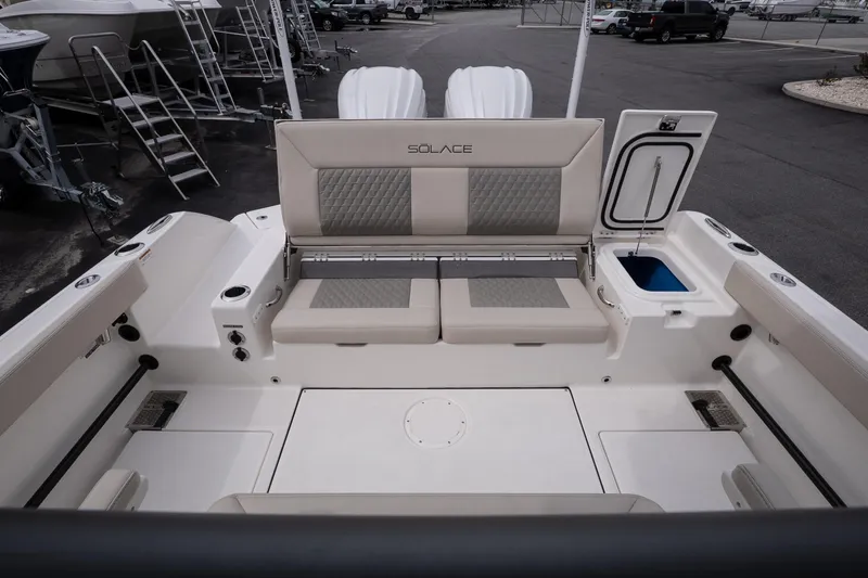 Slide: The Image of 2026 Solace 28 HCS boat interior with seating and storage compartments. - 15