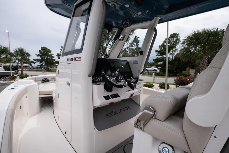 Slide: The Image of 2026 Solace 28 HCS boat interior with modern helm and seating. - 19