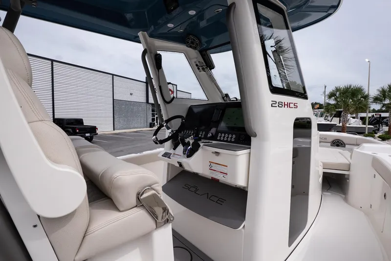 Slide: The Image of 2026 Solace 28 HCS boat interior with modern helm and seating. - 20