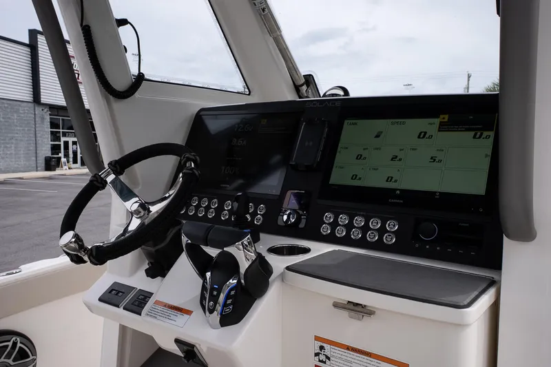 Slide: The Image of 2026 Solace 28 HCS boat dashboard with advanced controls and digital display. - 21