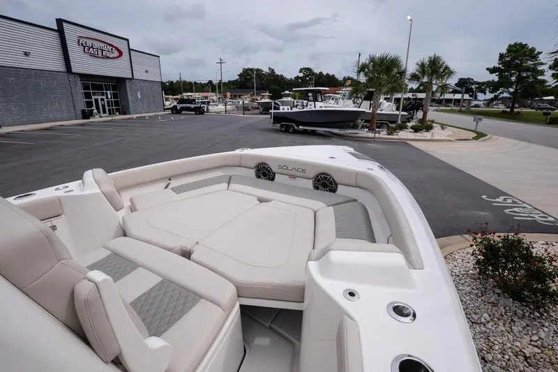 Slide: The Image of 2026 Solace 28 HCS boat displayed at Performance East Inc dealership. - 26