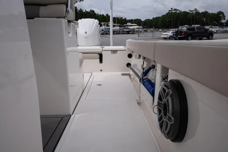 Slide: The Image of Interior view of 2026 Solace 28 HCS boat, showcasing seating and storage features. - 28