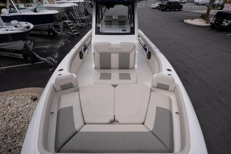 Slide: The Image of 2026 Solace 28 HCS boat interior with cushioned seating and modern design. - 29