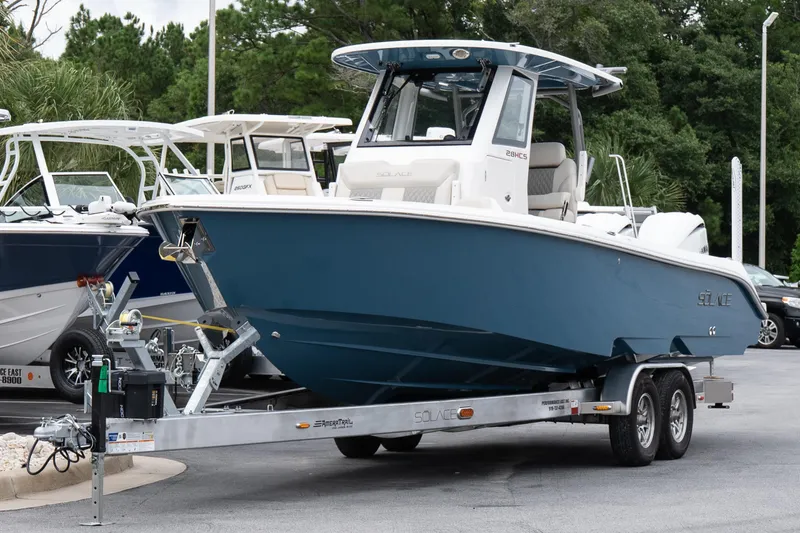Slide: The Image of 2026 Solace 28 HCS boat on trailer, displayed outdoors. - 3