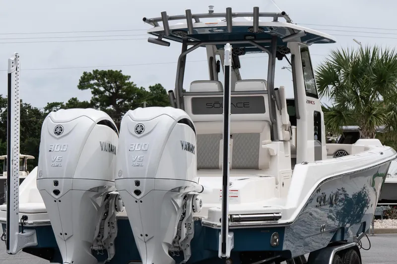Slide: The Image of 2026 Solace 28 HCS boat with dual Yamaha 300 V6 engines, docked outdoors. - 7