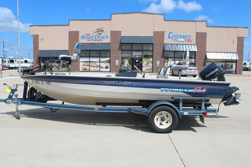 Slide: The Image of 1997 Crestliner 1750 Tournament Pro boat on trailer, parked outside dealership. - 1