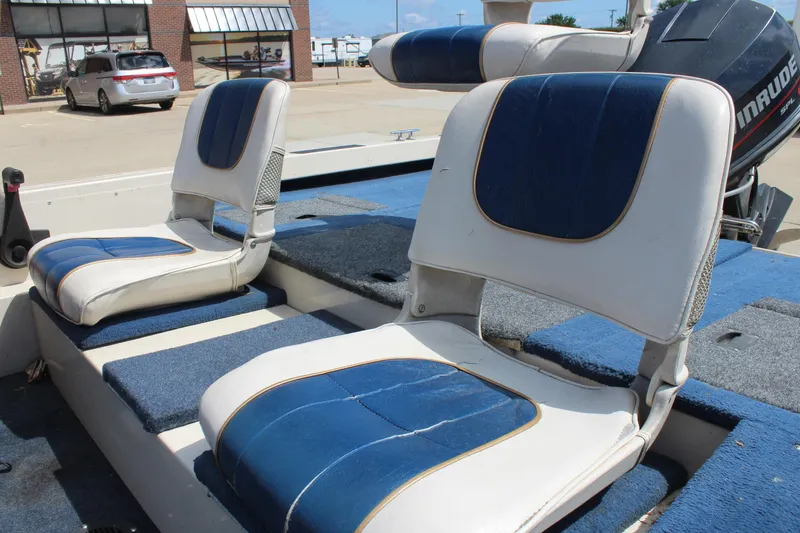 Slide: The Image of 1997 Crestliner 1750 Tournament Pro boat seats with blue and white upholstery. - 10