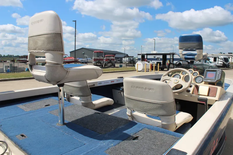 Slide: The Image of 1997 Crestliner 1750 Tournament Pro boat interior with steering wheel and seating. - 12