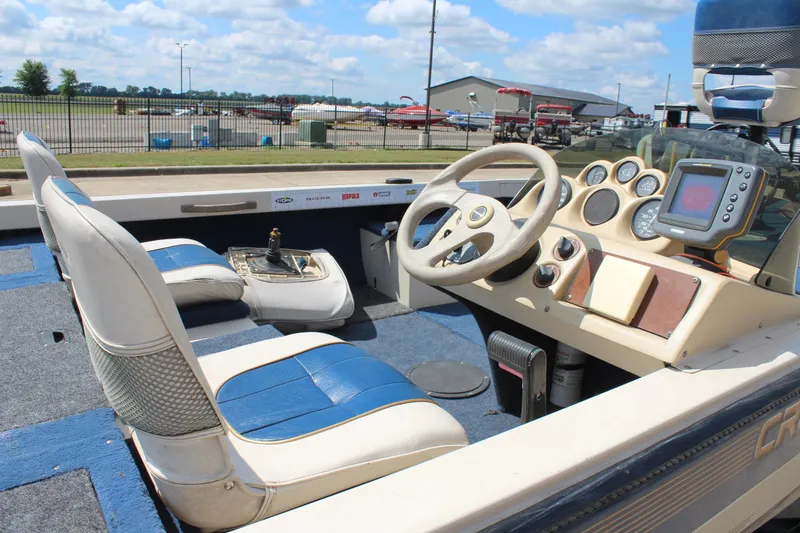 Slide: The Image of 1997 Crestliner 1750 Tournament Pro boat interior with steering wheel and dashboard gauges. - 14