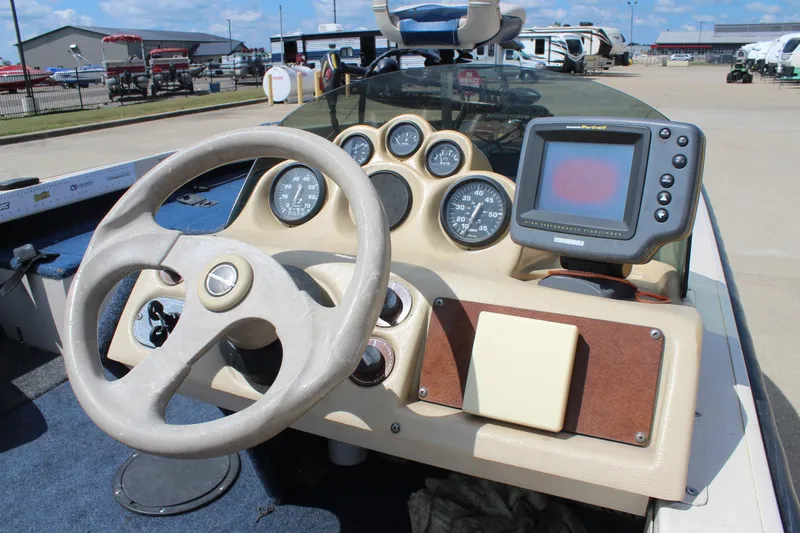 Slide: The Image of 1997 Crestliner 1750 Tournament Pro dashboard with steering wheel and gauges. - 15