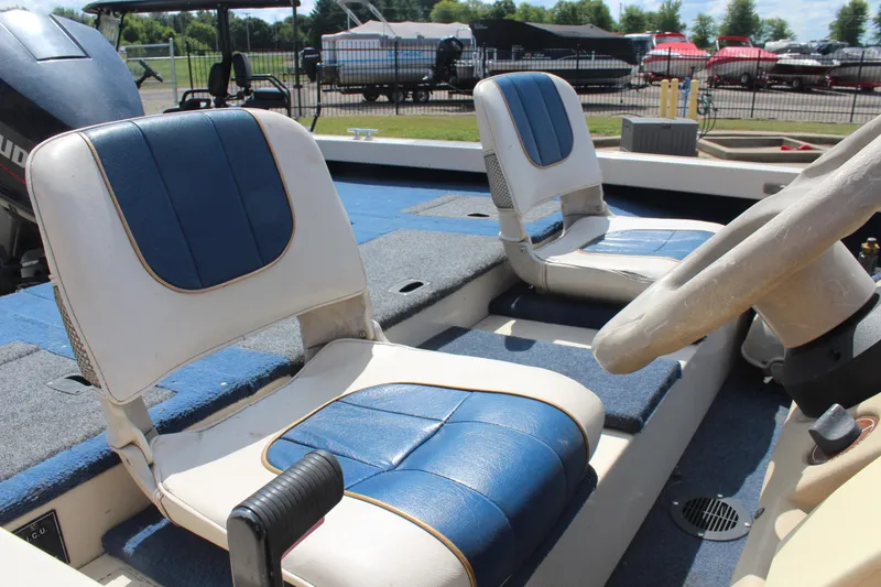 Slide: The Image of 1997 Crestliner 1750 Tournament Pro boat interior with blue and white seating. - 16