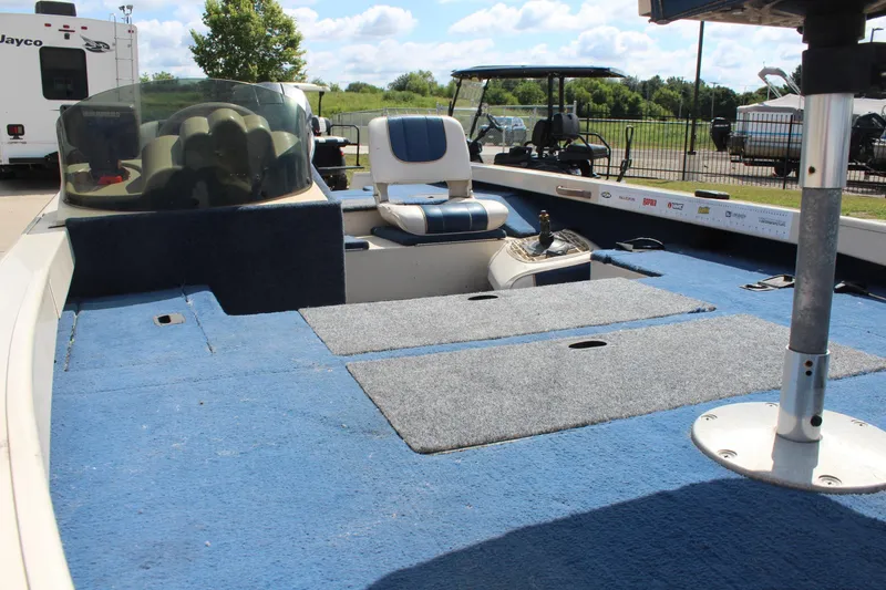 Slide: The Image of 1997 Crestliner 1750 Tournament Pro boat interior with blue carpet and seating. - 18