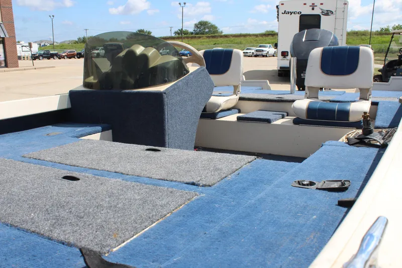 Slide: The Image of 1997 Crestliner 1750 Tournament Pro boat interior with blue carpet and seating. - 21