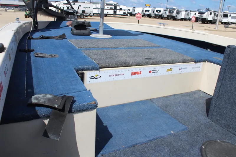 Slide: The Image of 1997 Crestliner 1750 Tournament Pro boat interior with blue carpet and fishing ruler. - 22