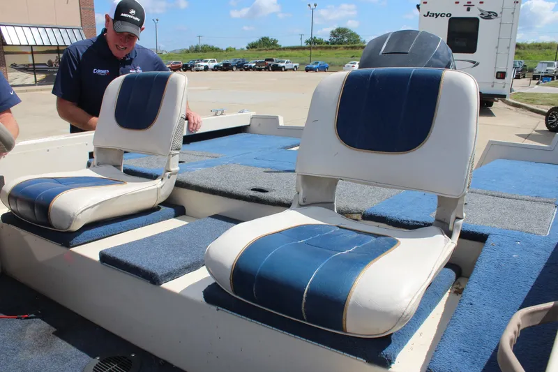 Slide: The Image of 1997 Crestliner 1750 Tournament Pro boat interior with blue and white seating. - 23