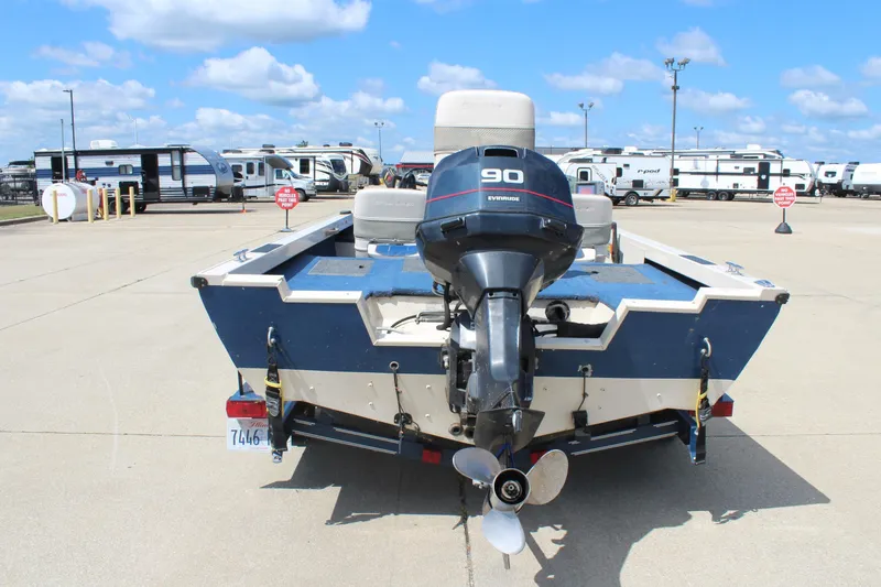 Slide: The Image of 1997 Crestliner 1750 Tournament Pro boat with Evinrude 90 engine in parking lot. - 3