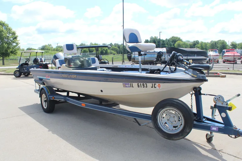 Slide: The Image of 1997 Crestliner 1750 Tournament Pro boat on trailer in parking lot. - 6