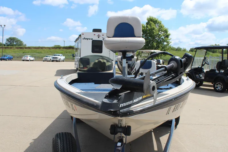 Slide: The Image of 1997 Crestliner 1750 Tournament Pro boat with Minn Kota motor in a parking lot. - 7