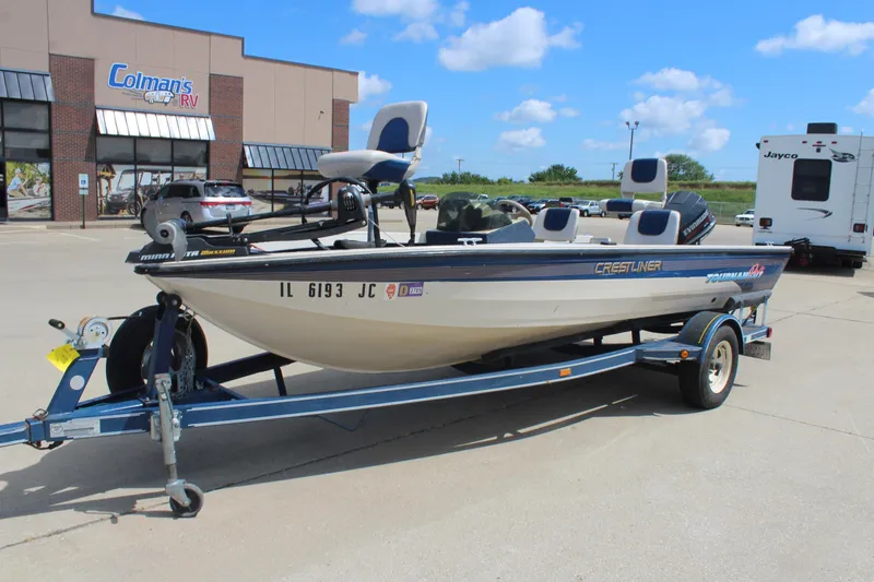 Slide: The Image of 1997 Crestliner 1750 Tournament Pro boat on trailer outside Colman's RV dealership. - 8