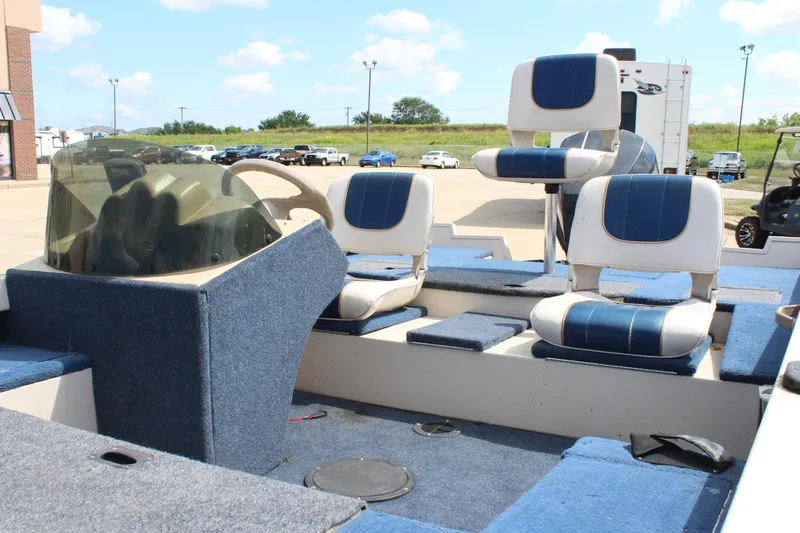 Slide: The Image of 1997 Crestliner 1750 Tournament Pro boat interior with blue and white seating. - 9