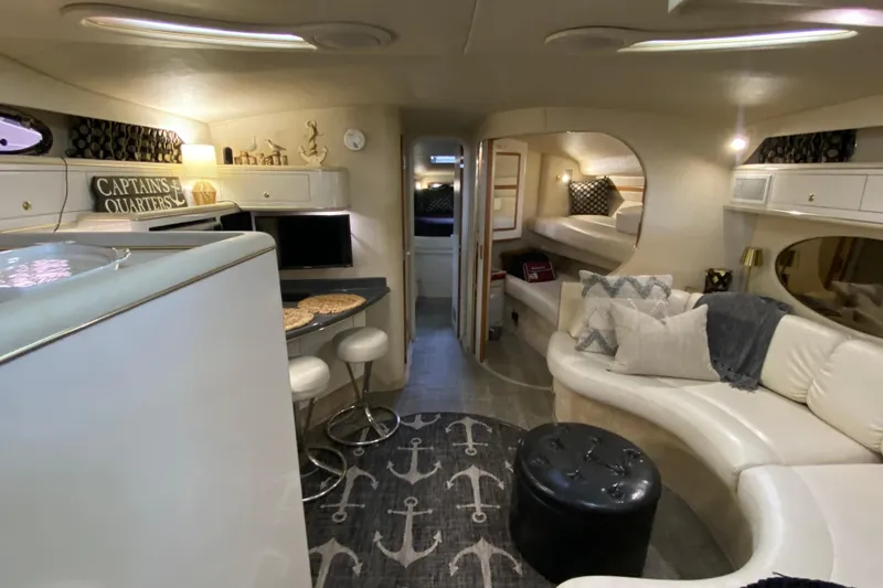 Slide: The Image of Luxurious interior of 1997 Sea Ray 400 Express Cruiser with modern amenities and stylish decor. - 13