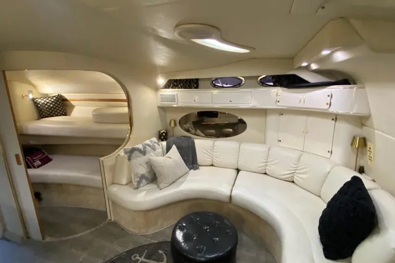 Slide: The Image of Luxurious interior of a 1997 Sea Ray 400 Express Cruiser with plush seating and elegant decor. - 16