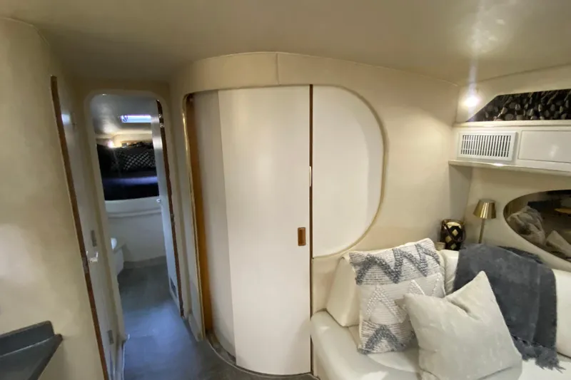 Slide: The Image of Interior of 1997 Sea Ray 400 Express Cruiser with cozy seating and modern decor. - 18