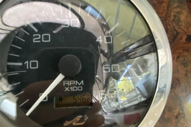 Slide: The Image of Close-up of 1997 Sea Ray 400 Express Cruiser RPM gauge showing 5462 RPM. - 32
