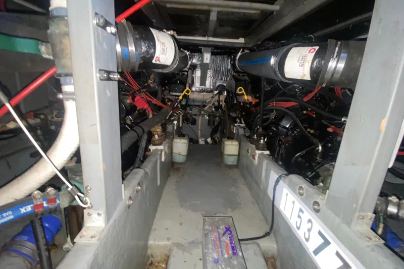 Slide: The Image of Engine room of 1997 Sea Ray 400 Express Cruiser with visible components and wiring. - 36