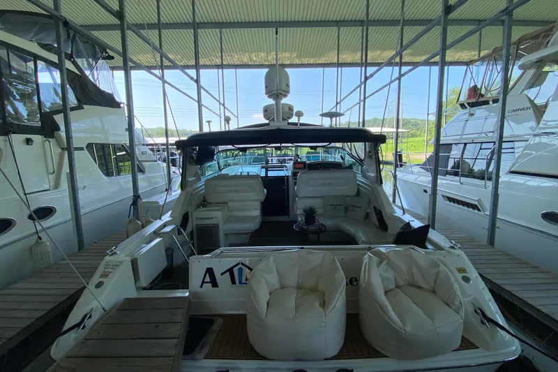 Slide: The Image of 1997 Sea Ray 400 Express Cruiser docked in a marina, interior view. - 5