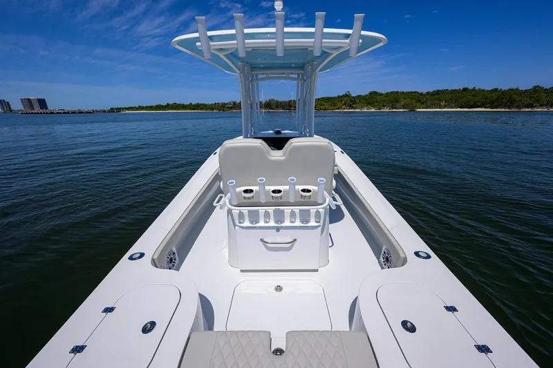 Slide: The Image of 2024 Conch 25 boat on calm water with clear blue sky. - 20